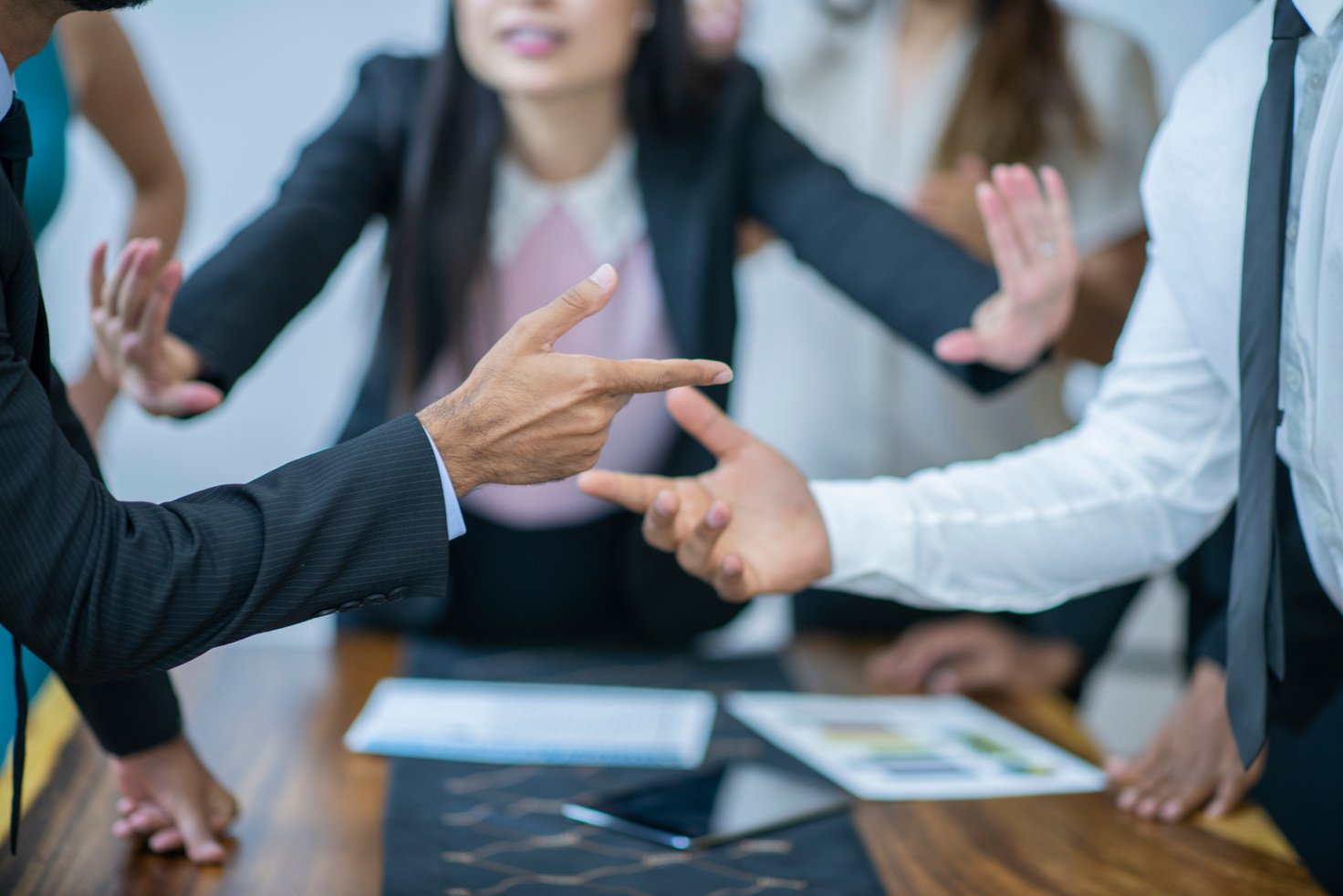 Asian women mediating disagreement